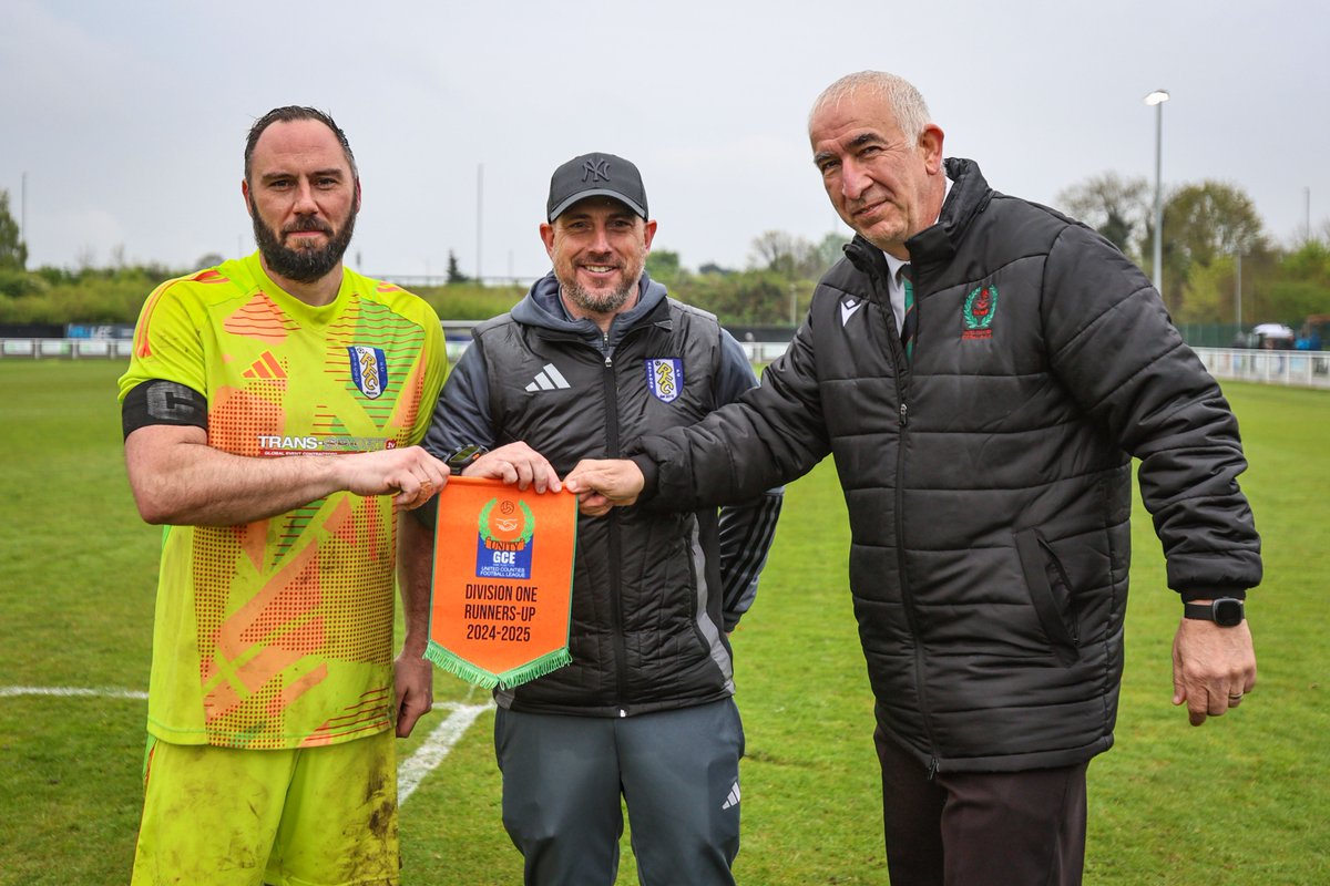 The players were presented with their runners up medals after the game this afternoon by the <a href="/utdcos/">UCL</a>  league as Jon Kennedy and Chris Woodhead accept a pennant from league official Ian Hughes.