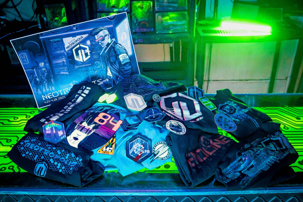 Just a little sample of official #Neotropolis merch items from the Megamall (M02):

new patches, stickers, t-shirts, sweatshirts, an enamel pin, posters, and restocks on items that sold out last year, too! 

(Cash or card only please, no barter accepted.)