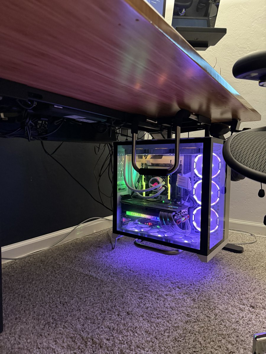 The metamorphosis continues.

New additions:
- hanging PC mount
- new cable management (bye bye Velcro!)
- new monitor arm