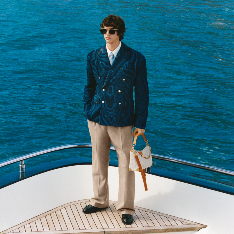 LouisVuitton's tweet photo. Anchors away. Sophisticated suiting and accessories transform the transatlantic transit into a wardrobe for the contemporary traveler, steeped in sporty details and naval nuances. Discover #LVMenPreFall25 by @Pharrell.

#PharrellWilliams #LouisVuitton