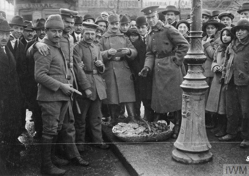 An Ottoman, Bulgarian, Austro-Hungarian and a German soldier posing on the streets of Bucharest, 1916/17.