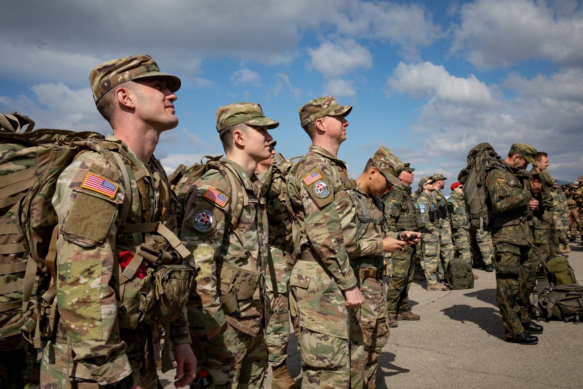 USArmyEURAF's tweet photo. Multinational @NATO_KFOR troops joined the #DANCON March at Camp Novo Selo, Kosovo

A Danish tradition since 1972, the march unites soldiers from around the world.

📷 by Sgt. Cheryl Madolev

#WeAreNATO #SwordOfFreedom #KFOR https://t.co/gbR0Fu5yxQ