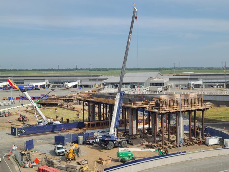 FlySMF's tweet photo. 🚧 SMF Pedestrian Walkway Construction🚧
Earlier this month, crews removed the forms for the columns and continued installing falsework. The slab pour for the Hub took place on April 21, and rebar work has been ongoing across the site to support construction progress. #SMForward https://t.co/miapa6JOCK