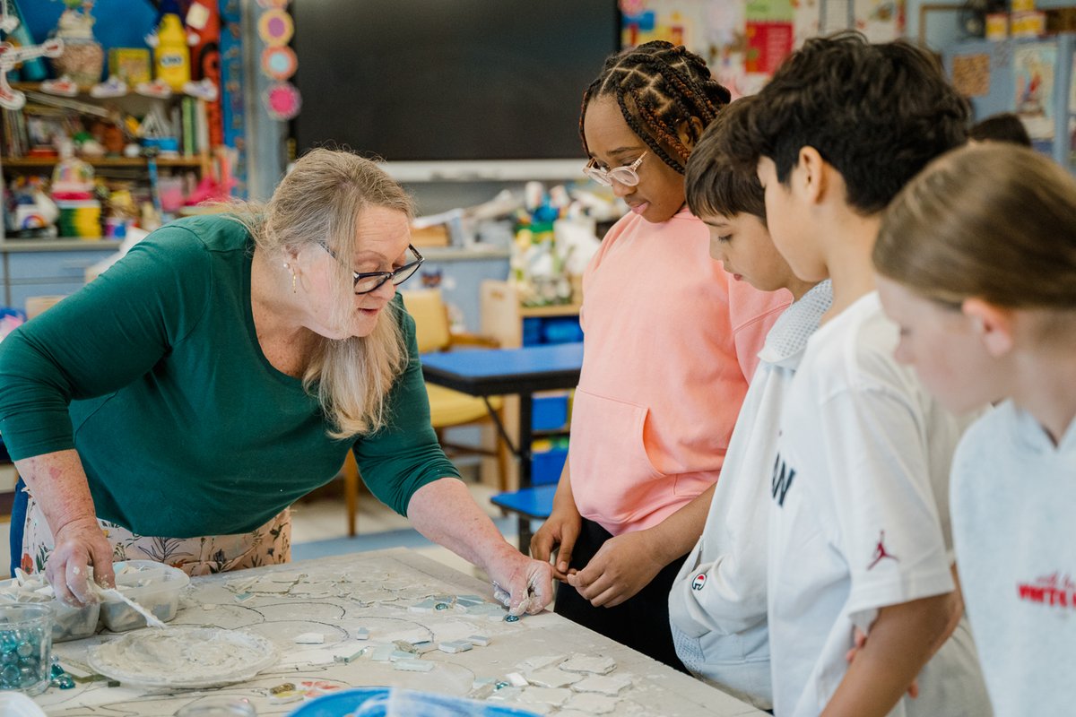 Students at CCS are working with artist-in-residence Esther J. Tollen this week to create a new mosaic mural for the all-purpose room! 🖌️🧱 The project blends hands-on creativity with a lesson in art history. #CharlesCampagne #StudentArt #WeAreBethpage