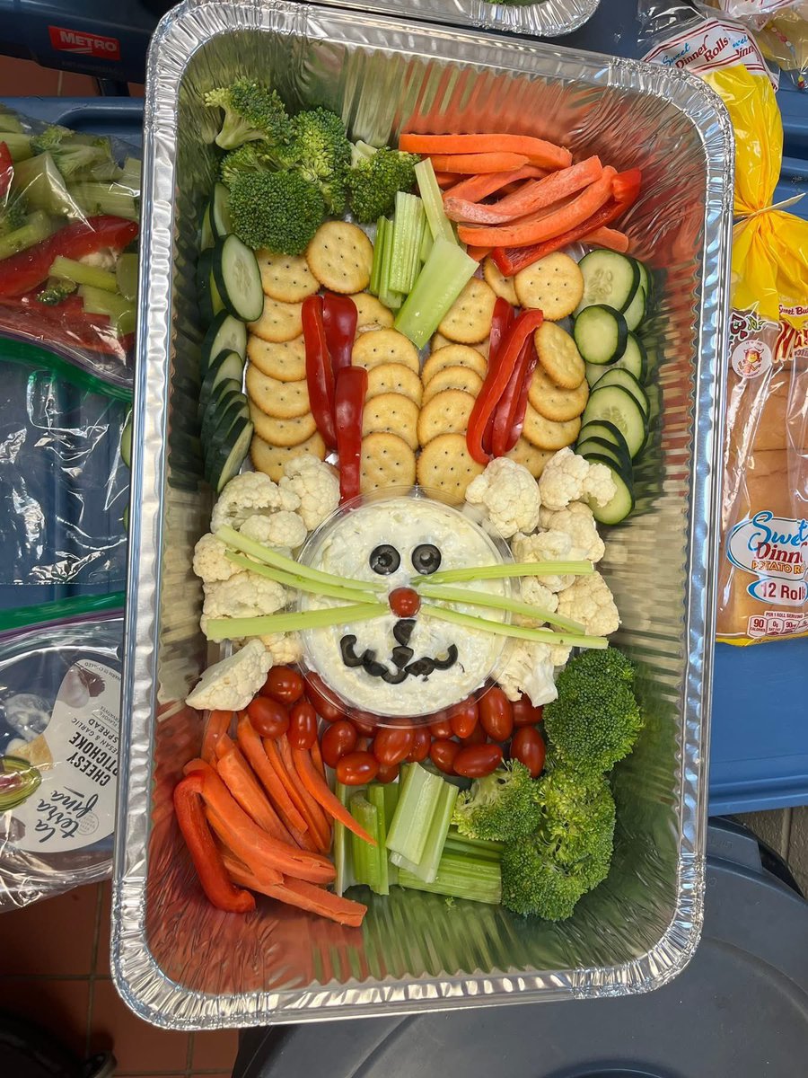 The Be Our Guest service team prepared an Easter themed dinner for our neighbors at Guest House - complete with ham, cheesy potatoes, glazed carrots, lemon bars and a bunny veggie platter. We have so much fun cooking together &amp; sharing God’s love through a homemade meal.