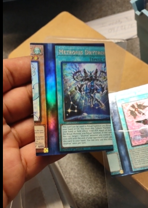 A reddit user got Yu-Gi-Oh multiple ultimate rares from Stampede miscut so  badly they feature 2 different cards in each one.