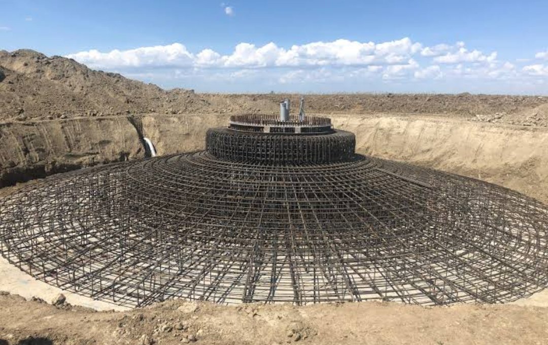 ONE modern onshore wind turbine typically requires in its 20 year life:

1000 tonnes of concrete foundation
40 tonnes of steel rebar/reinforcement
40 tonnes of fibreglass blades
12 tonnes of epoxy/polyester blade resin
300 metric tonnes of tower steel 
5000 litres of