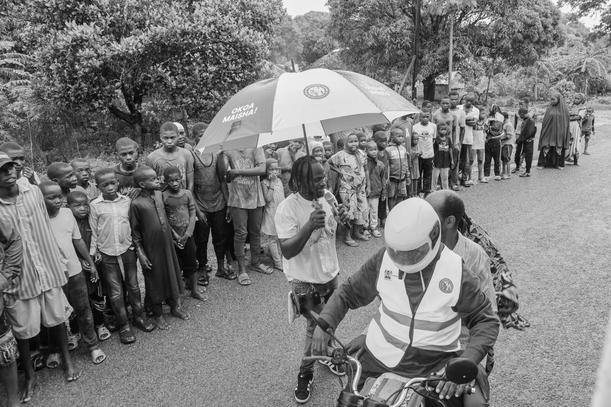 The downpour couldn't dampen our spirits today as we continued raising awareness for the EMC SBCC Campaign. We powered through! On a related note, this rainy season does bring an increased risk of malaria, so let's all remember to take precautions and stay safe.
