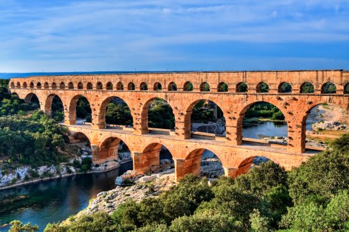 Optionnaire's tweet image. Hear me out. Roman Engineering sleep-away camp for men (and women). You learn and practice the Roman engineering techniques used to build their most magnificent structures such as the Pont du Gard. Amirite?
