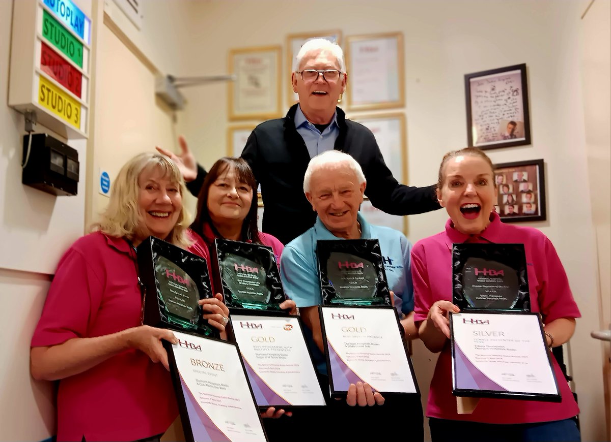 Legendary broadcaster Steve Colman popped into  our  studios to present us with our  trophies and certificates from the National Hospital Radio Awards held on 5 April 2025.  From left to right: Nikki, Dawn, Terry and Eileen with Steve Colman at the back.