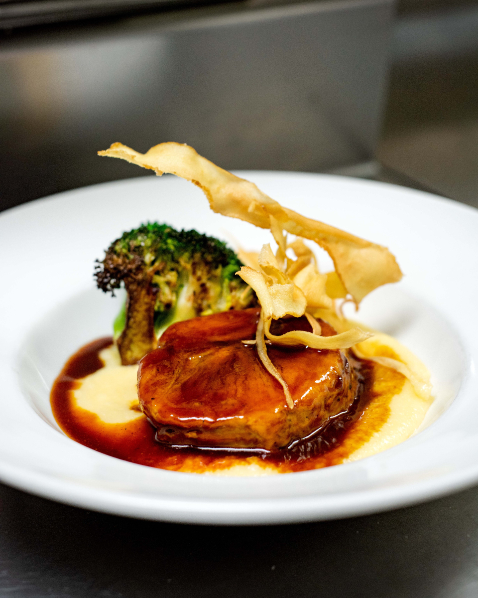 Slow-cooked Berkshire Pork, creamy parmesan polenta, charred broccoli, and crisped parsnips — comfort food at its finest!