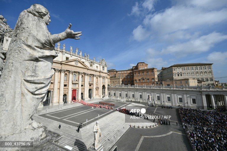 Pallbearers, next to Swiss Guards, carry the coffin of the late Pope Francis on St Peter's Square, in the Vatican