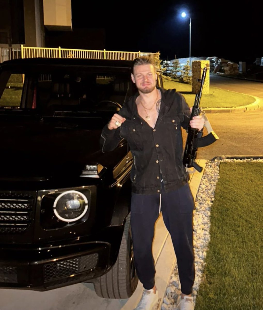 KimJongBettman's tweet photo. Val Nichushkin flaunting his Stanley cup ring while holding a machine gun is insane. What a player https://t.co/zQ3W1Tyv4D