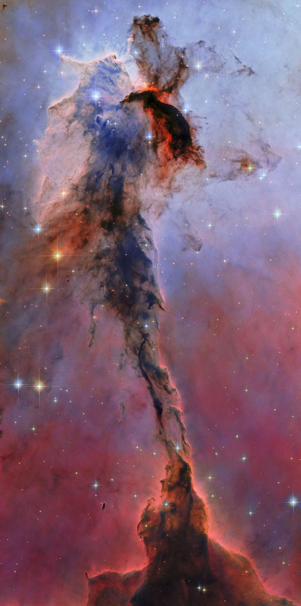raidurgesh's tweet photo. Eagle nebula catured by the Hubble is a pillar of cold gas and dust that is 9.5 light-years tall. https://t.co/SjFL097ZT1 https://t.co/Z4Mw65mM9C
