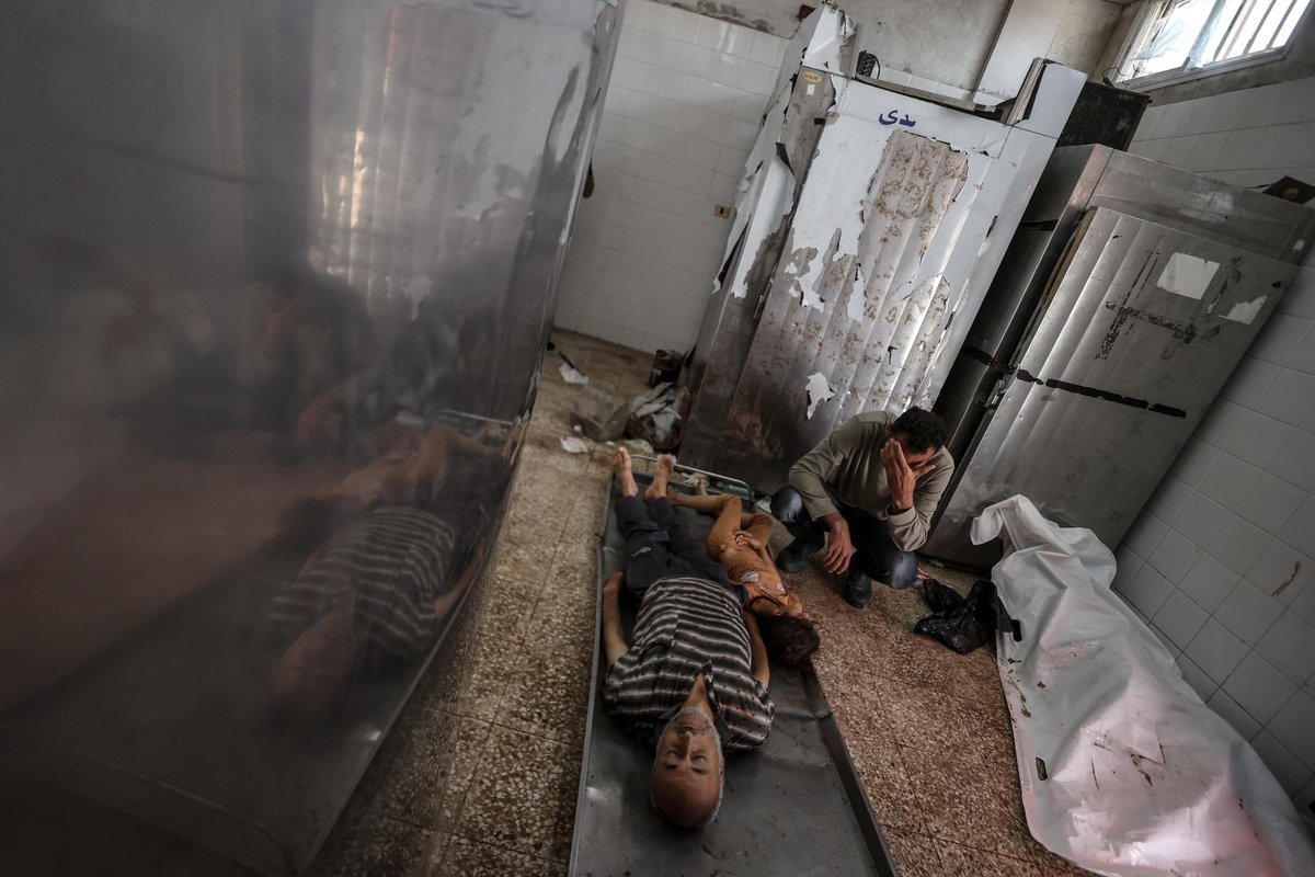 Relatives of the Palestinians who died as a result of Israeli attacks on ez-Zawaydah area of Gaza City, mourn as the dead bodies brought to the al-Aqsa Martyrs Hospital for burial in Deir al-Balah, Gaza on April 25, 2025. Three Palestinians, including children, were killed and