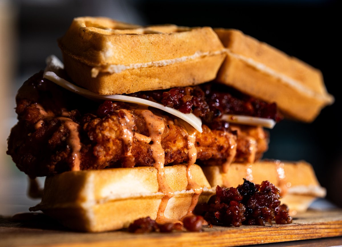The Astros have a new fried chicken waffle sandwich made with pepper jack cheese, bacon onion jam and honey chipotle aioli 🤤