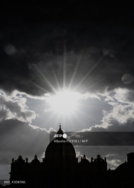 Pope lies in state in a coffin at St Peter's Basilica in the Vatican