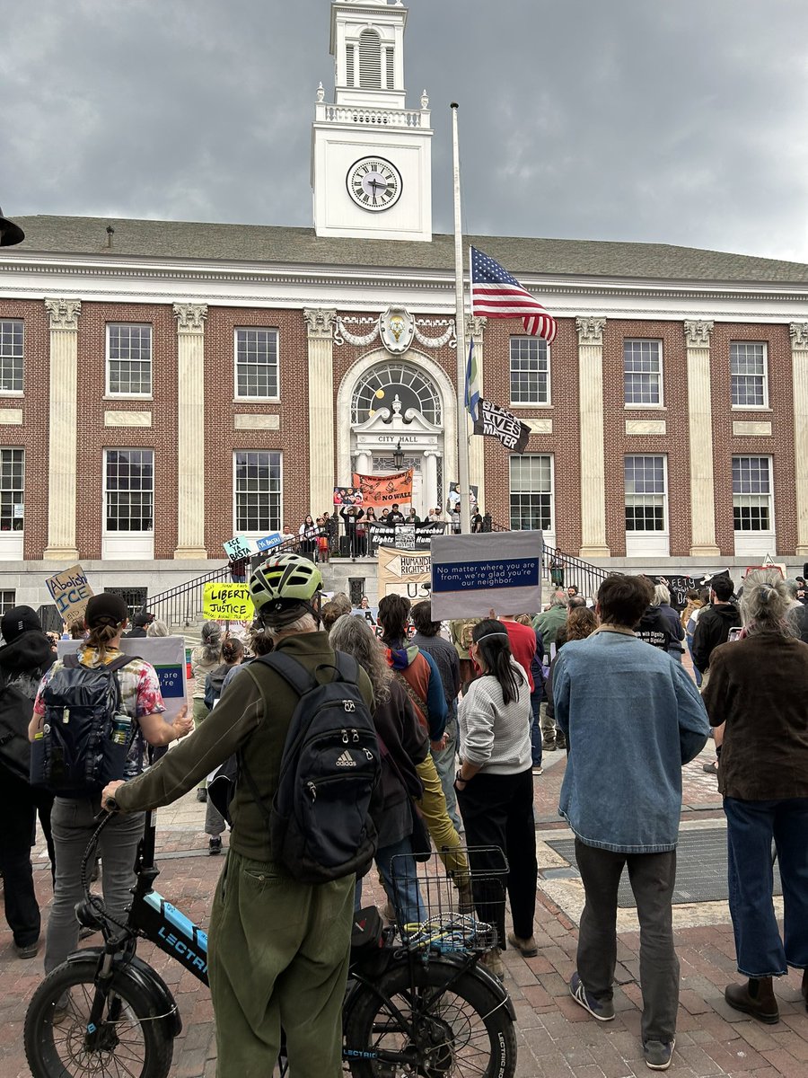 Emroy's tweet image. Vermonters protesting Border Patrol's apprehension of eight workers on a dairy farm.
