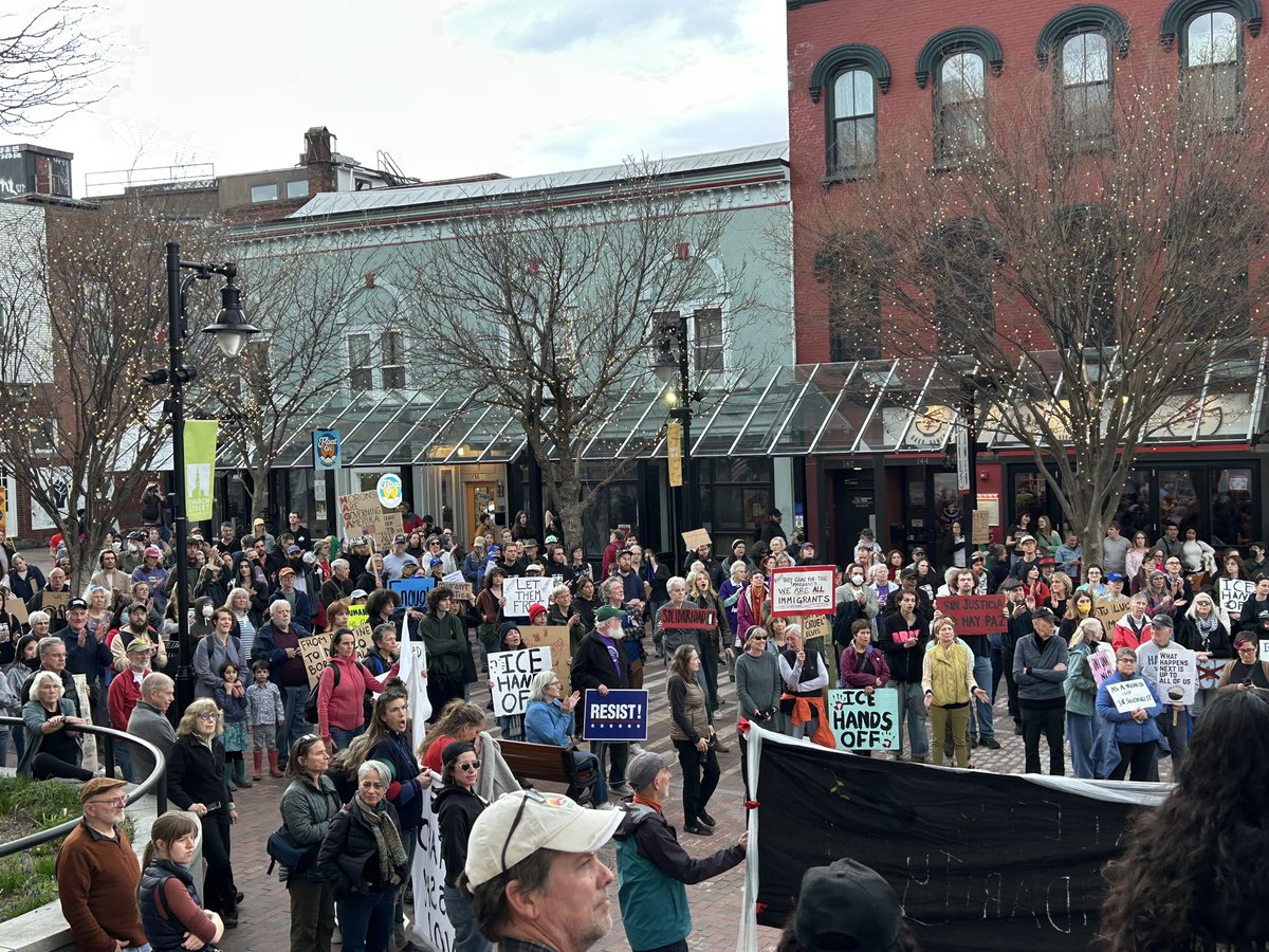Emroy's tweet image. Vermonters protesting Border Patrol's apprehension of eight workers on a dairy farm.