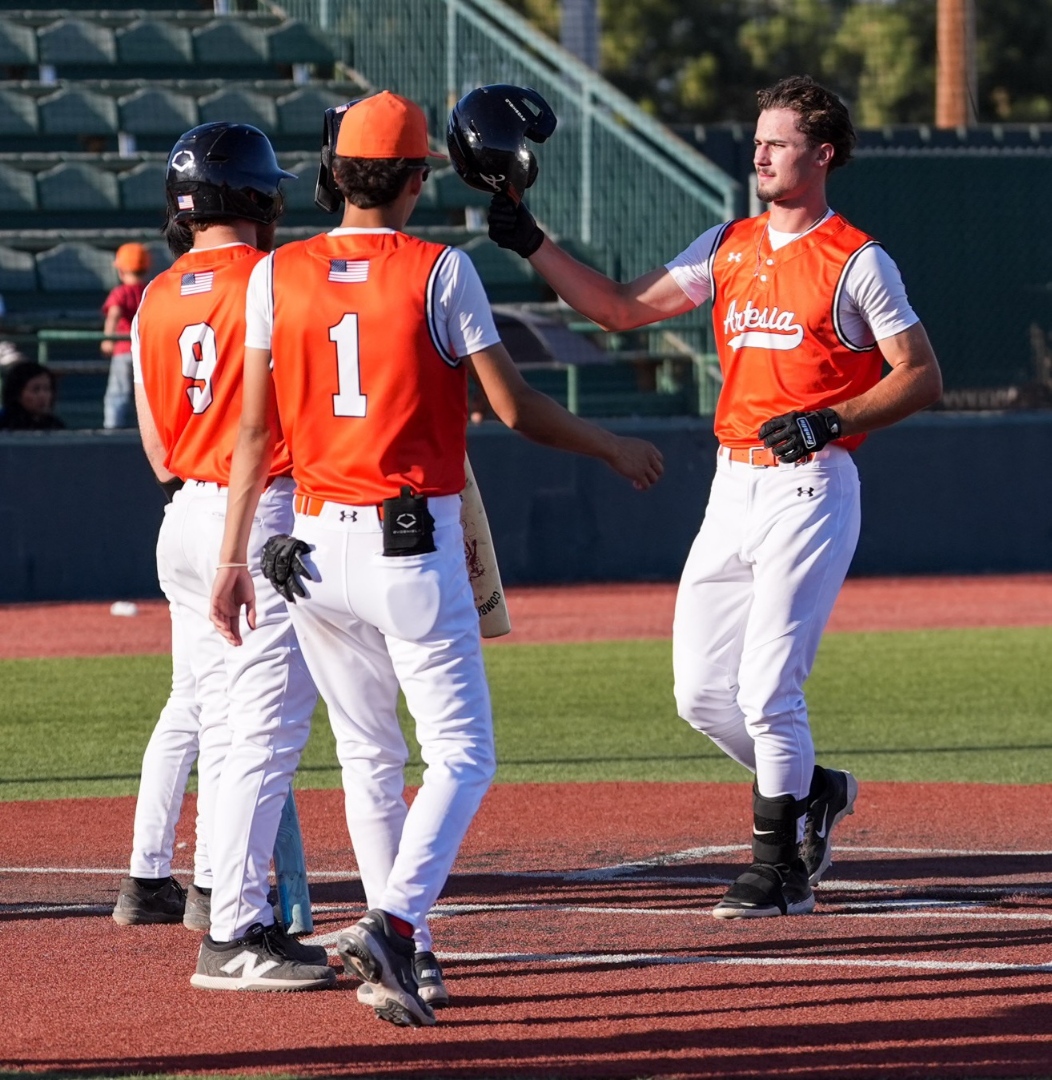 Jack Byers is greeted at home plate by Daelon Pacheco (9) and Diego Morales (1) following a two-run shot in the marathon bottom of the fourth.

📸 TJ Palma - Artesia Bulldog Paw Prints