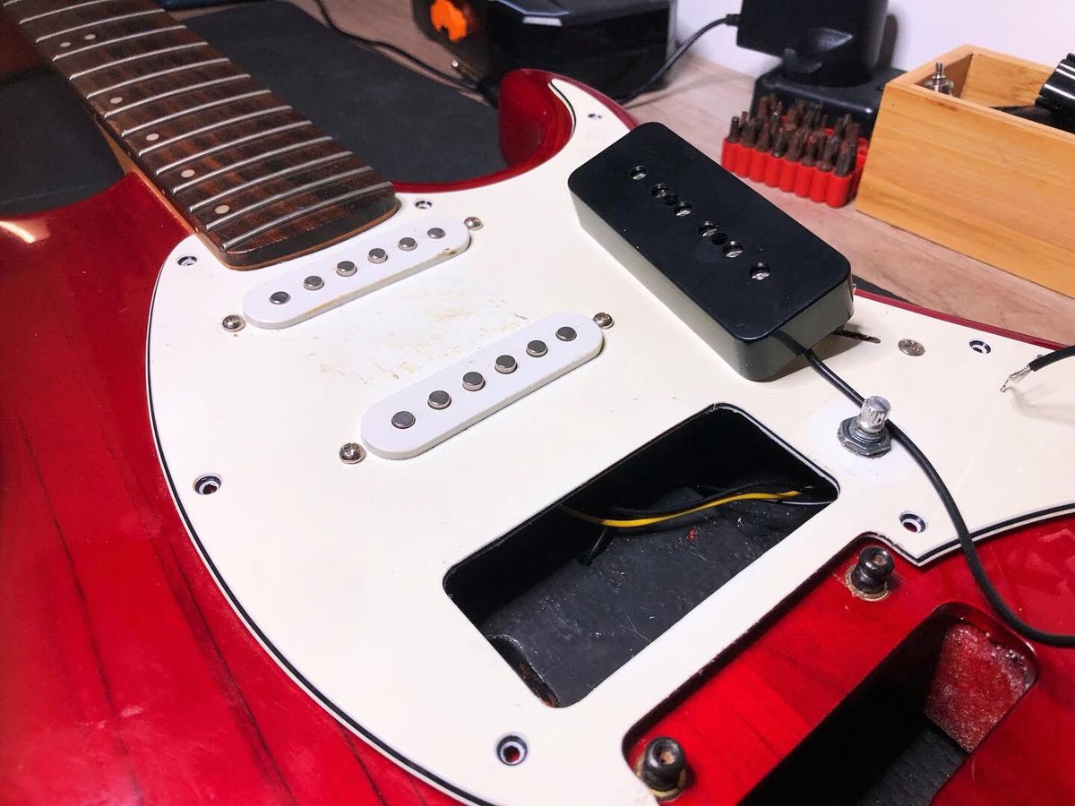 RumbleRepairs's tweet photo. Black #P90 Installed at the bridge of this @CortGuitars Strat. As the new #pickup is wider, precise cutting and shaping of the #scratchplate is essential. P90s are a fatter tone single coil, perfect for #rock, #jazz &amp; #blues. Wired &amp; ready soon. Enjoy it Cat 🎸 #guitars #sligo https://t.co/wF09dzygyd