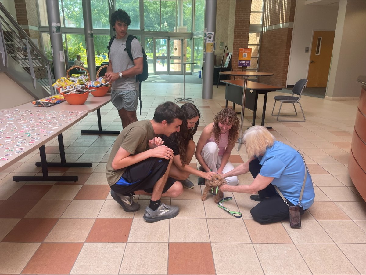Finals got you stressed? Davis College of Business &amp; Technology had the paw-fect fix! 🐶 Students took a break to cuddle with service dogs during Happy Hour—bringing smiles, wagging tails &amp; stress relief. Good luck on finals, Davis College Dolphins!