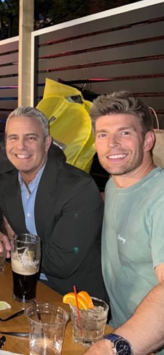 Both of their smiles pull in opposite directions