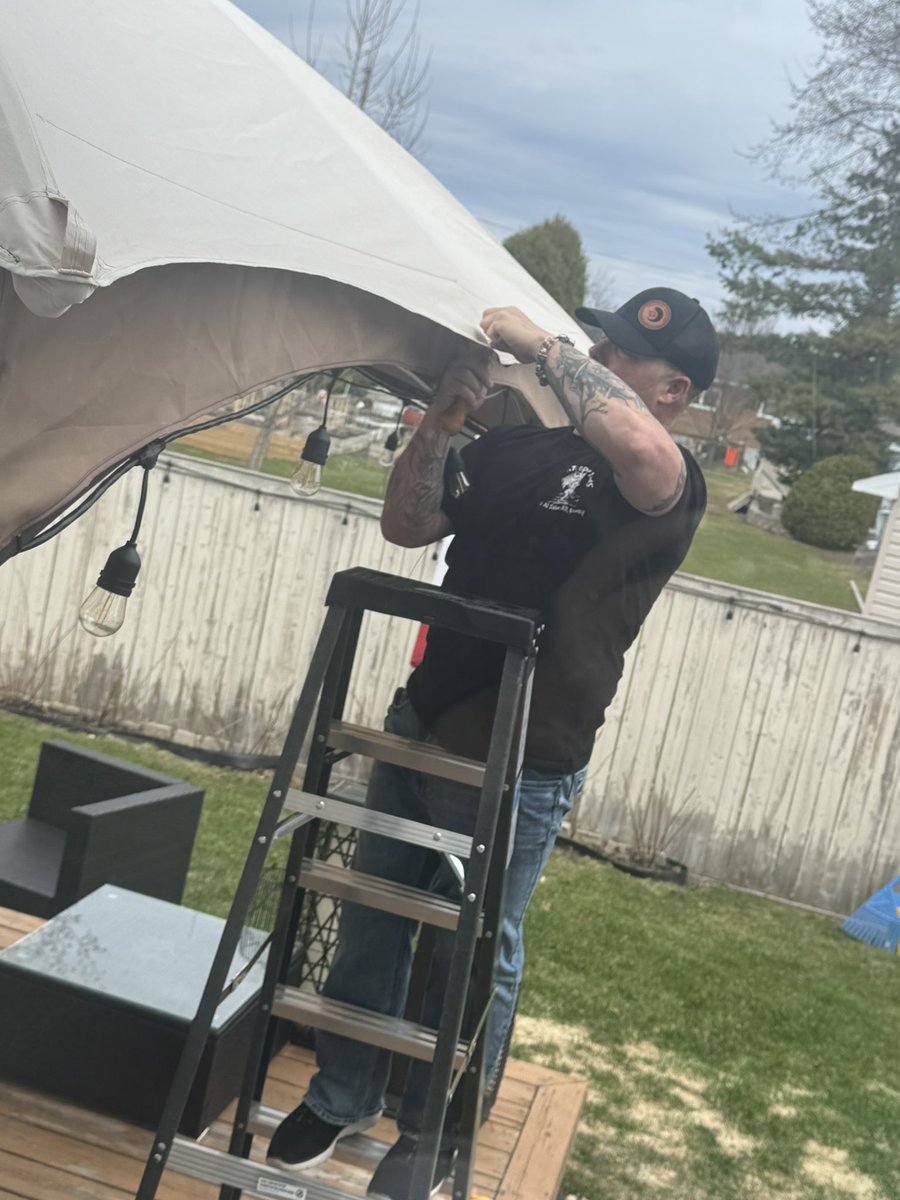 TWilsonOttawa's tweet image. You learn a lot of useful skills in the army. Look at this guy fixing my old gazebo awning. We’ll get another year out of it now. 🇨🇦❤️ #manpower