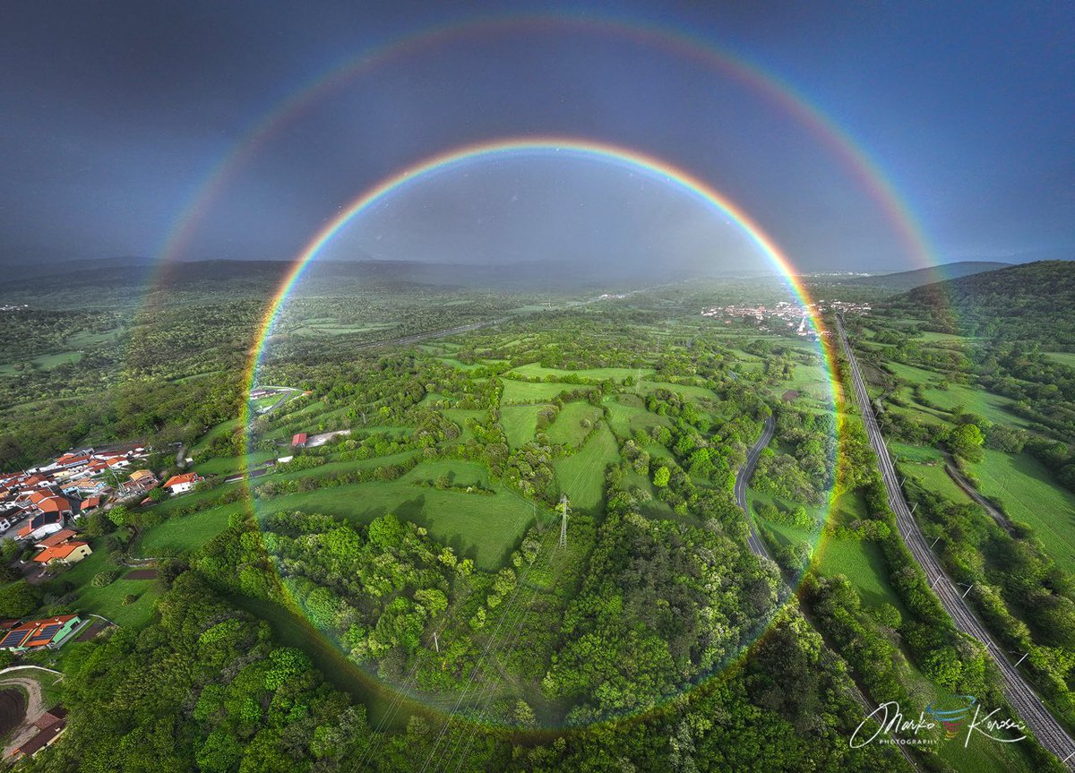 Experienced a full-circle double rainbow during afternoon showers yesterday. A rare sight to see, actually. This is a panoramic view created from multiple photos, photographed with the drone.

Location &amp; date: Zirje, Slovenia - April 24th, 2025