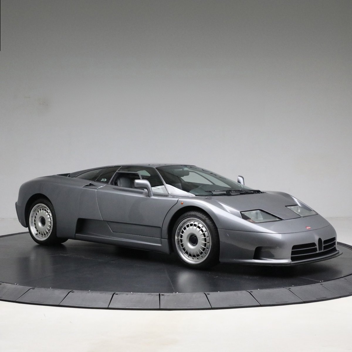 duPontREGISTRY's tweet photo. 1993 Bugatti EB110 GT | 1 of 136 produced globally!

This Grigio Scuro spec is powered by a 3.5L quad-turbocharged V12 engine rated at 553 horsepower, working alongside a six-speed manual transmission. https://t.co/3jK7QSzBWn