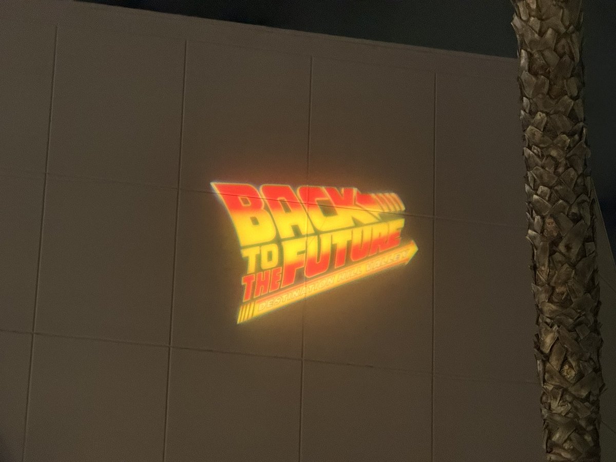 UniNewsToday's tweet photo. Not the Back to the Future: Destination Hill Valley logo being projected onto the former Back to the Future ride building 😂 https://t.co/h80bGXpAUz