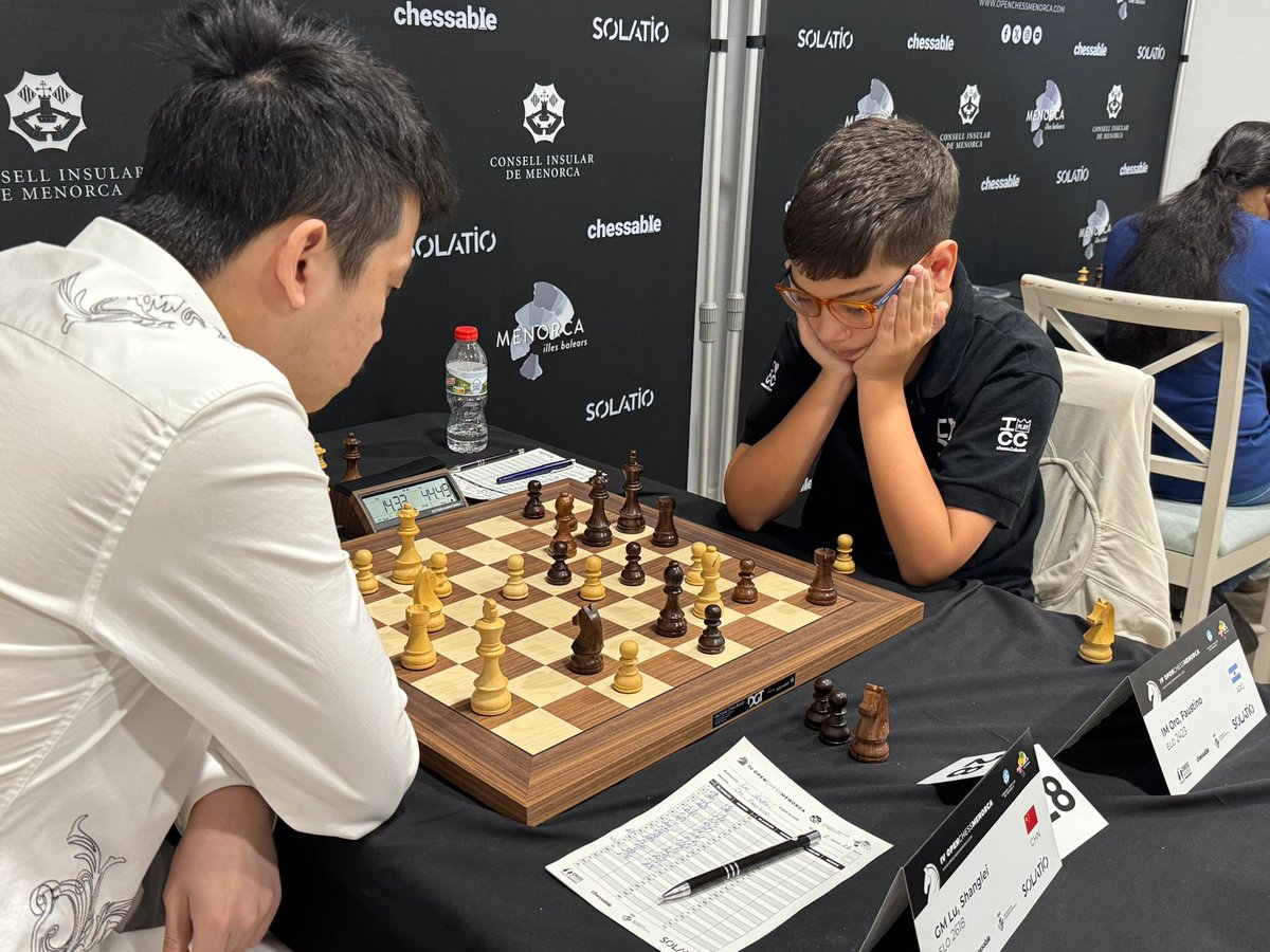 ICC chessclub.com (@chessclubicc) on Twitter photo Faustino Oro 🇦🇷 (<a href="/FaustiOro/">Faustino Oro</a>) is facing Lu Shanglei 🇨🇳 2618) in Round 7 of the Menorca Open—and it’s turning into quite a thriller!
Can the 11-year-old hold his ground against the 2618 Chinese player? Faustino Oro 🇦🇷 (<a href="/FaustiOro/">Faustino Oro</a>) is facing Lu Shanglei 🇨🇳 2618) in Round 7 of the Menorca Open—and it’s turning into quite a thriller!
Can the 11-year-old hold his ground against the 2618 Chinese player?