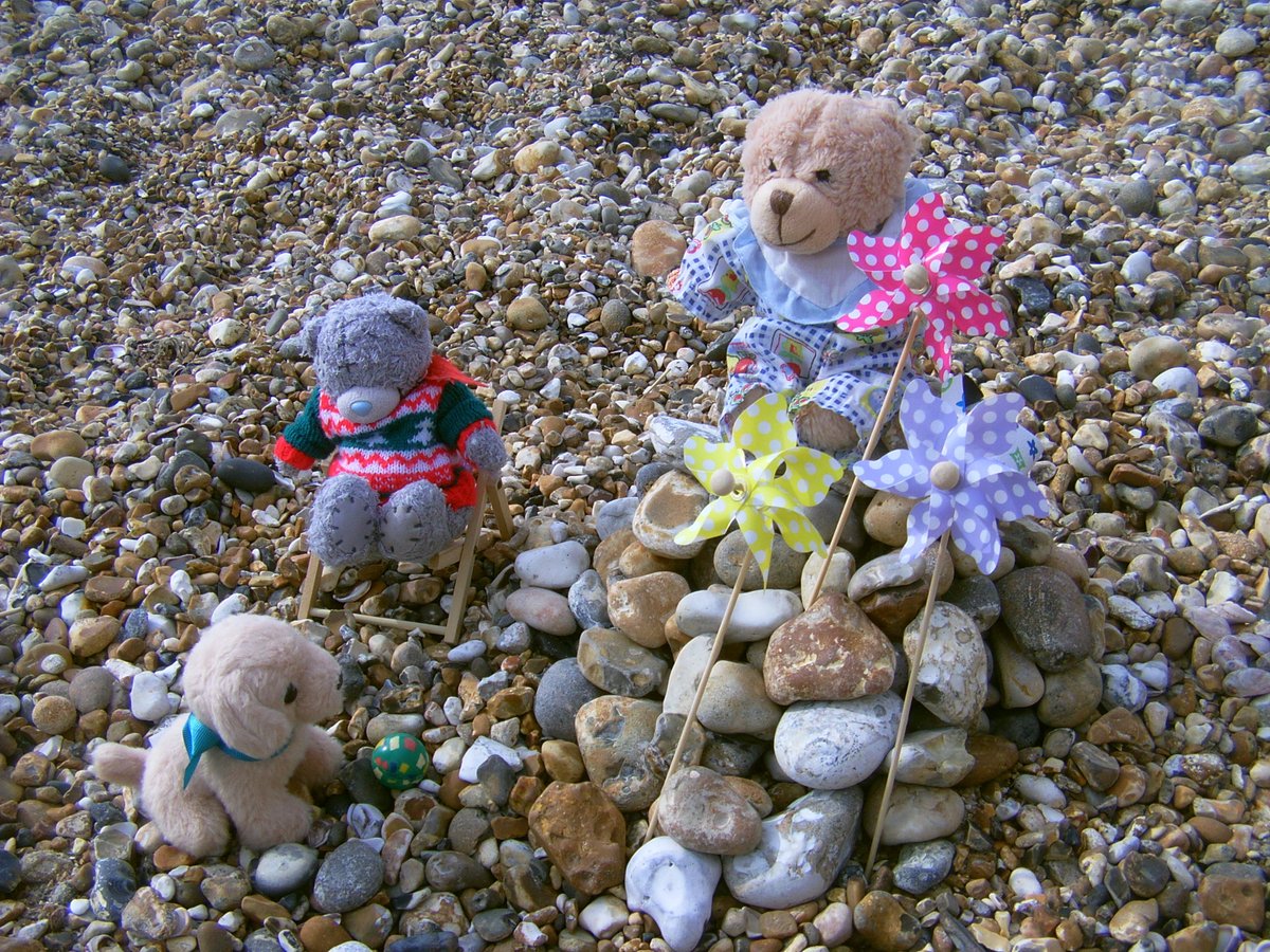 Teddy45825659's tweet photo. Lucky built a huge tower of stones! 

"Wait. Where did the windmills come from? Poundstretcher?" 🙈 

But then we went to the pier &amp; it all went wrong. No, they didn't notice Derek hiding in the rucksack, but *someone* got caught with his paw in a slot and we all got BANNED!!! 😳 https://t.co/KS9OIyf6DS
