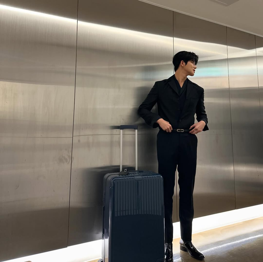 Standing tall with my suitcase in hand, like a man ready to chase what’s his. The road ahead’s long, but I’m built for it