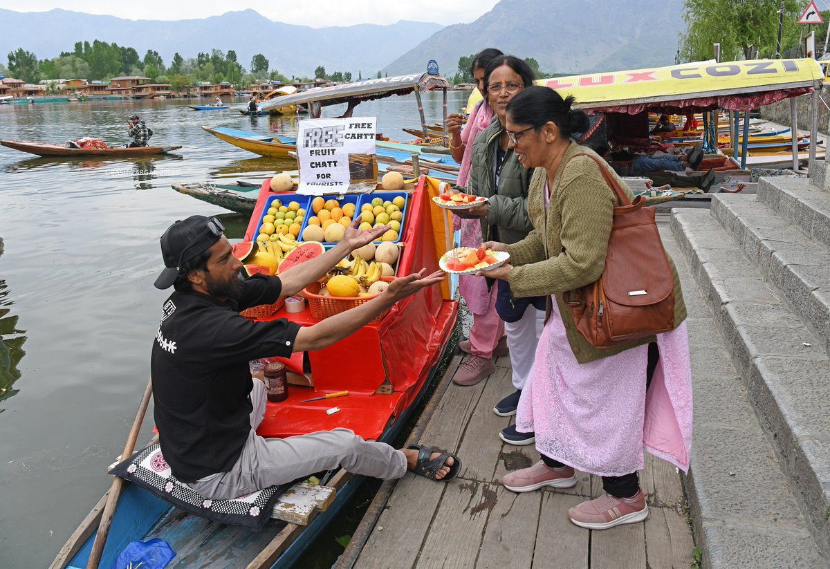 Hashim Ali, a shikara fruit seller on Dal Lake, Srinagar, provides free fruit chaat to tourists, spreading kindness in the wake of the Pahalgam attack