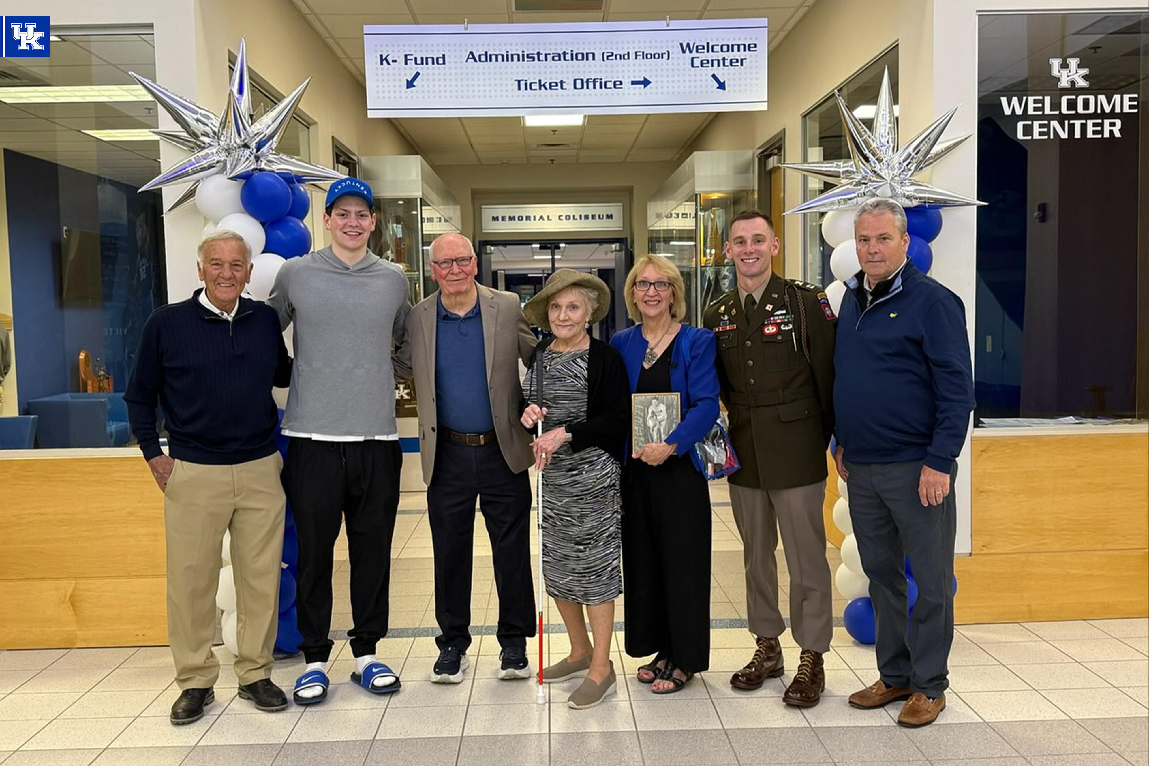 Trent Noah with Captain Kenneth England's family at Joe Craft Center. 