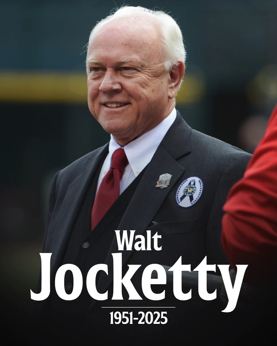 Walt Jocketty 1951-2025
A photo of Walt Jocketty in a black suit, white dress shirt and red tie.