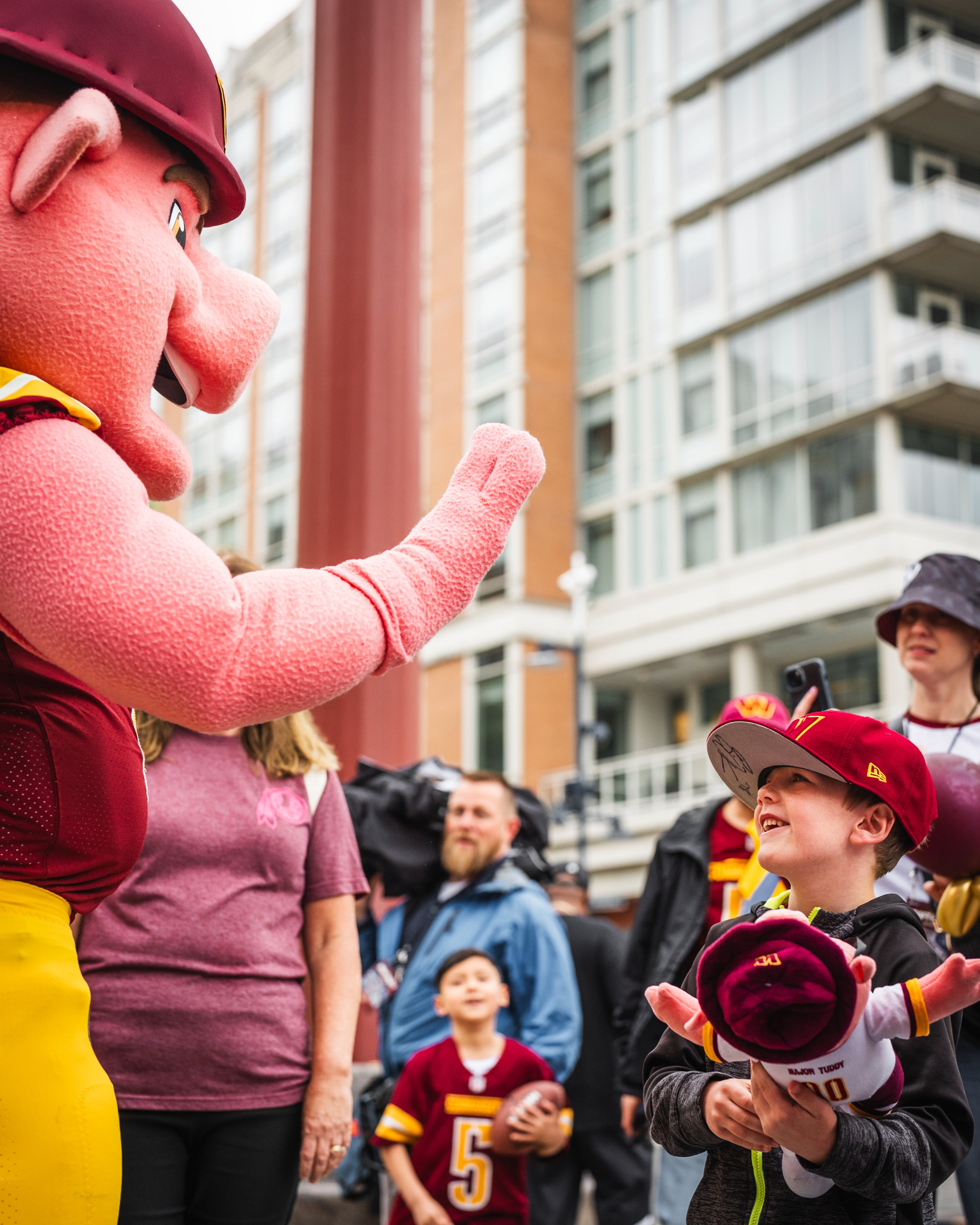 Photo from the Draft party at National Harbor. Major Tuddy is high fiving a young fan.