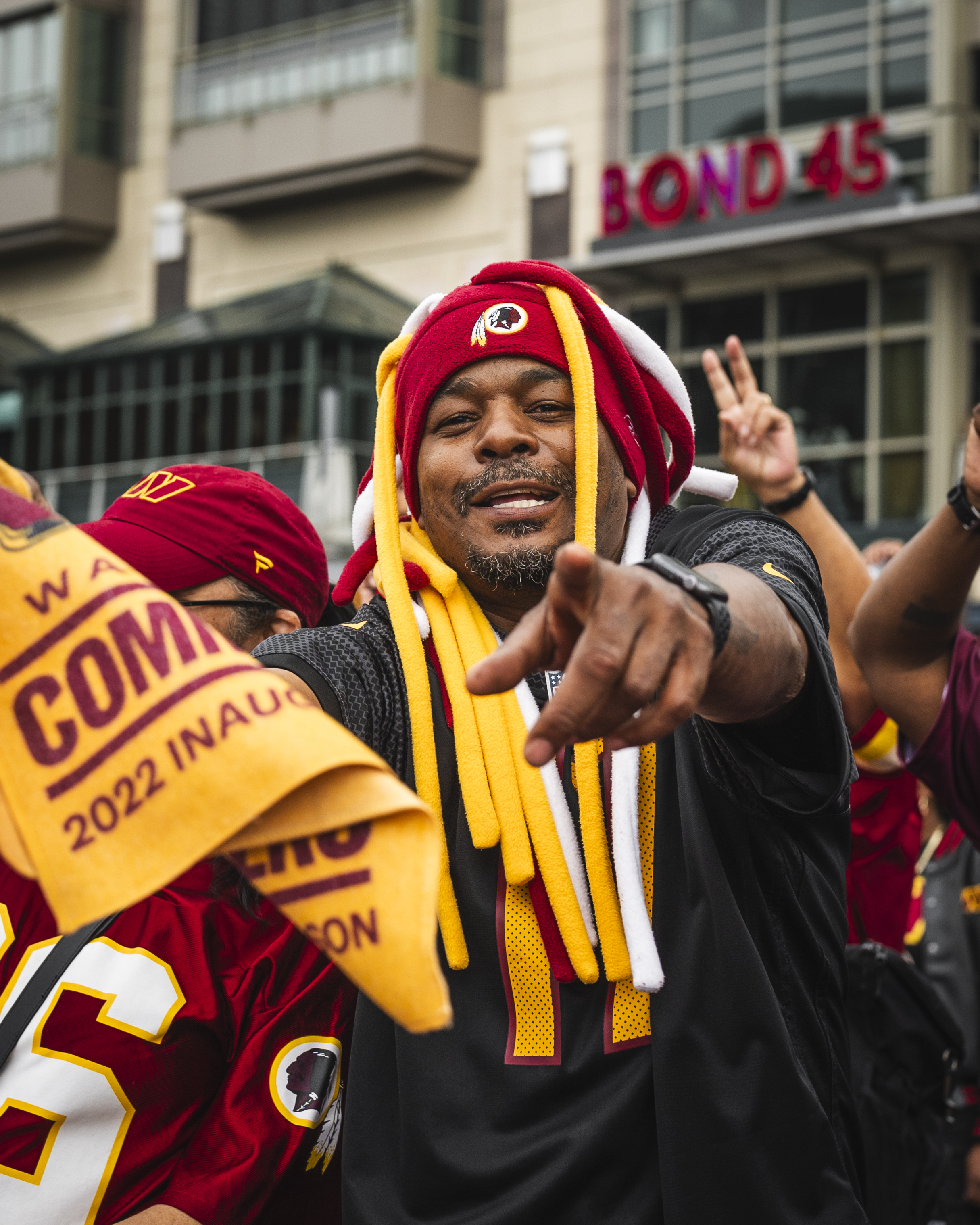 Photo from the Draft party at National Harbor. A fan is pointing at the camera.