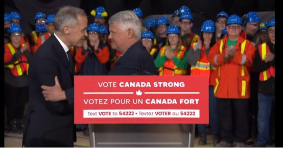 joshryanjames's tweet photo. Algoma steel worker says none of the people standing behind Carney in this photo actually work at Algoma Steel, nor does he recognize the blue hard hats. https://t.co/WN0nSuBX5f