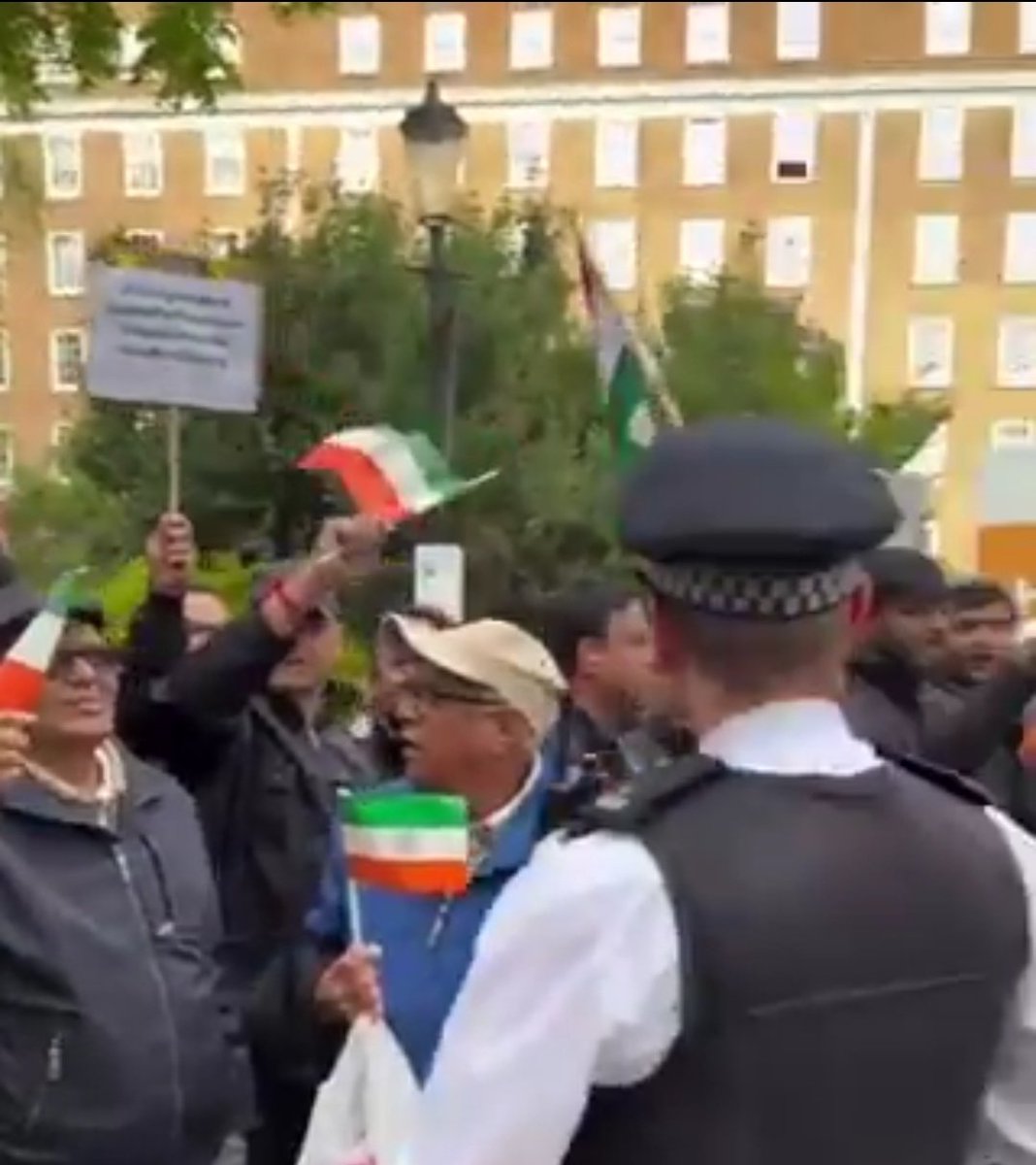 zoo_bear's tweet photo. But why are NRI uncles holding our Indian flags upside-down? https://t.co/JuV9e9q8al