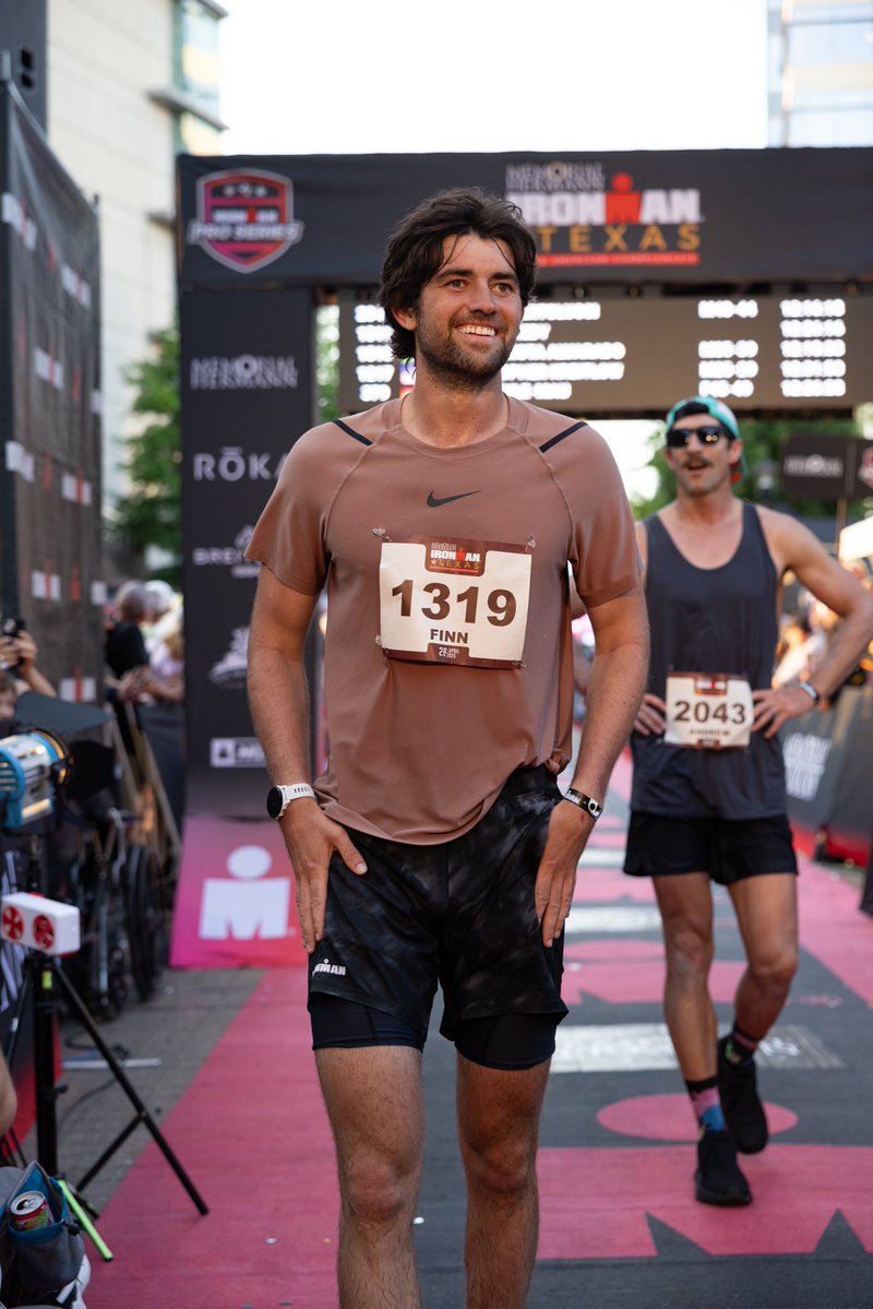 RobertKennedyJr's tweet image. Finn crosses finish line after swimming, cycling and running 140.3 miles in 12hrs 26 mins.
Finish line medal with Cheryl and two Iron Man legends, Mark Allen and Finn’s coach, Cameron Wurf, who finished today’s race in just over 7 hours breaking the world IM cycling record.
