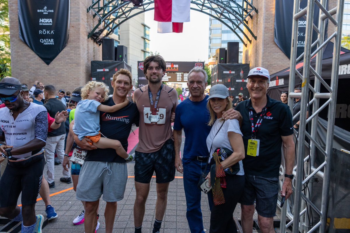 RobertKennedyJr's tweet image. Finn crosses finish line after swimming, cycling and running 140.3 miles in 12hrs 26 mins.
Finish line medal with Cheryl and two Iron Man legends, Mark Allen and Finn’s coach, Cameron Wurf, who finished today’s race in just over 7 hours breaking the world IM cycling record.