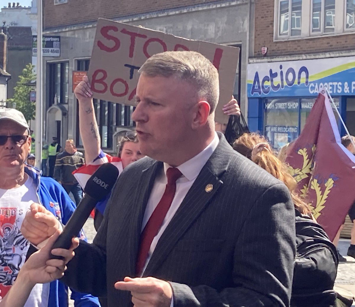 Paul Golding of Britain First is here, met with support from protestors - saying “the illegal immigration crisis is out of control”