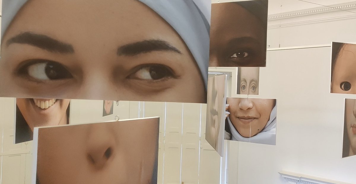 CLIFTON PARK MUSEUM. These simple mobiles rotate in the breeze, merging old exhibits with modern-day faces in constant reinvention. Some of the combos make me smile, like this young kid with an old chin.