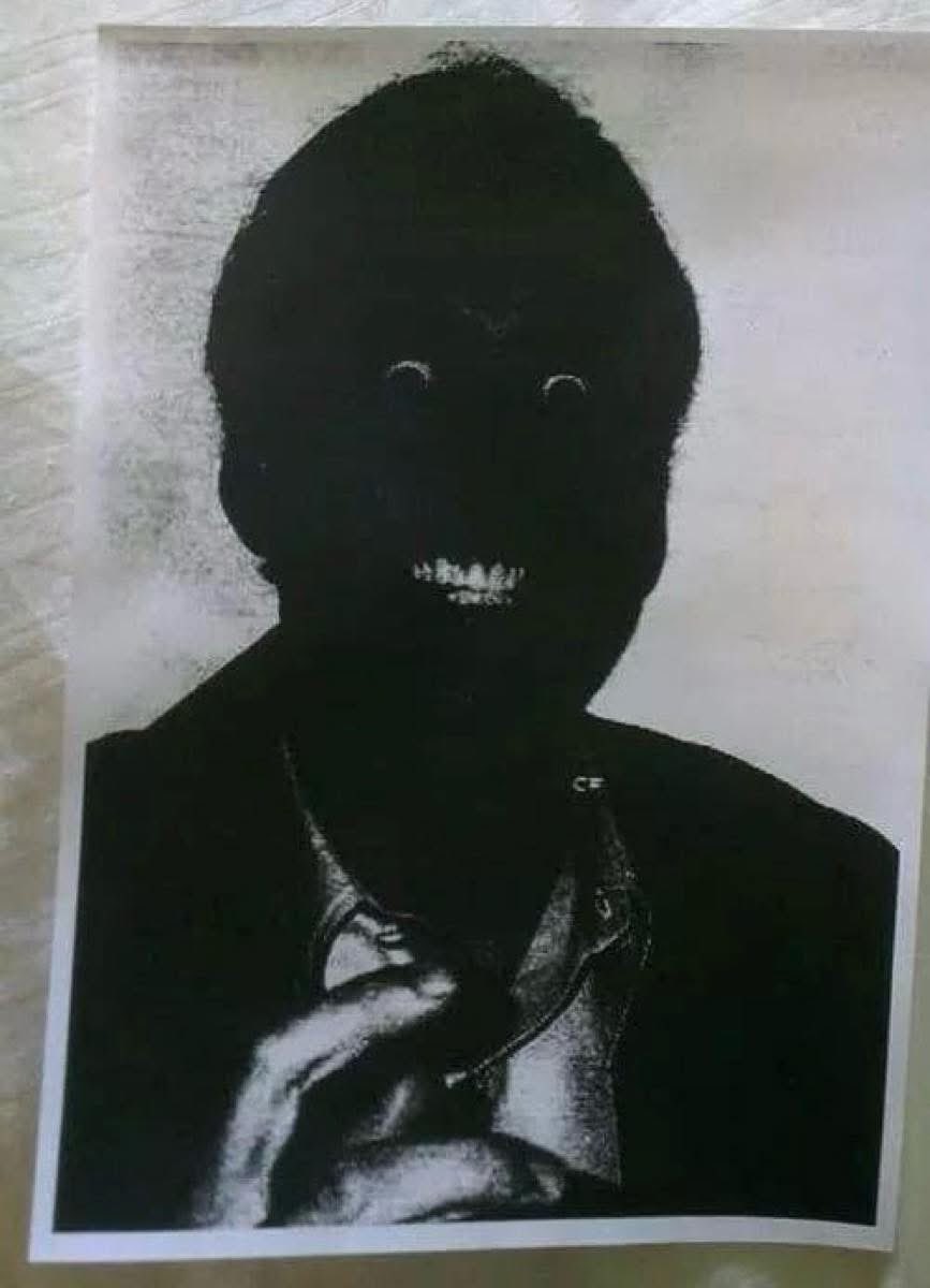 creepydotorg's tweet photo. The result of a broken printer printing off a pic of Nicolas Cage. https://t.co/0Djabz4l6C