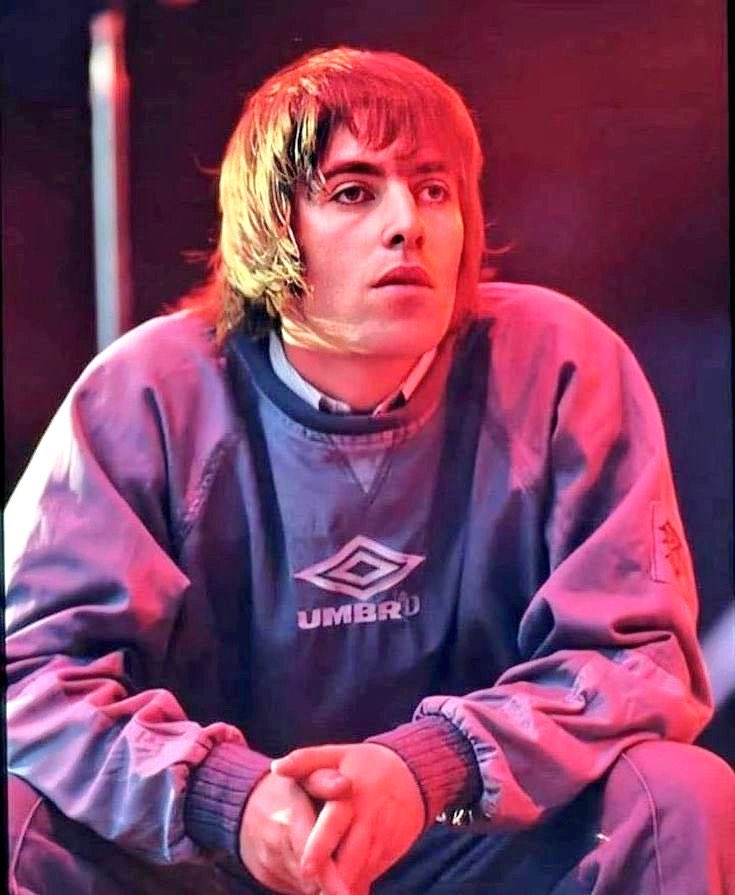 OasisMania's tweet photo. UMBRO to release Liam Gallagher's iconic pullover tomorrow to coincide with Oasis' 29th anniversary playing night two of Maine Road https://t.co/yfBFCOgqlZ