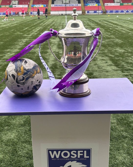The West of Scotland Football League Cup trophy, on a stand at Broadwood and next to a football.
