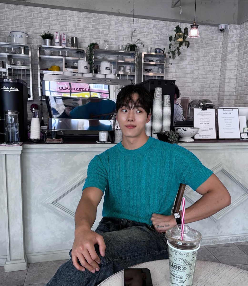 Hanging out at her cafe because I can.