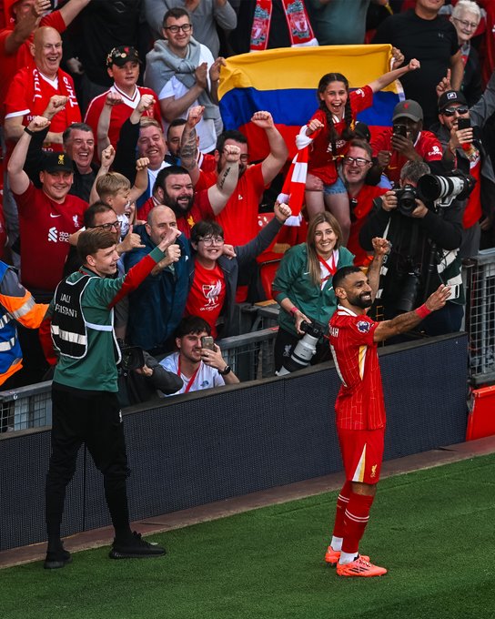 Photography of Mo Salah celebrating his goal against Tottenham.